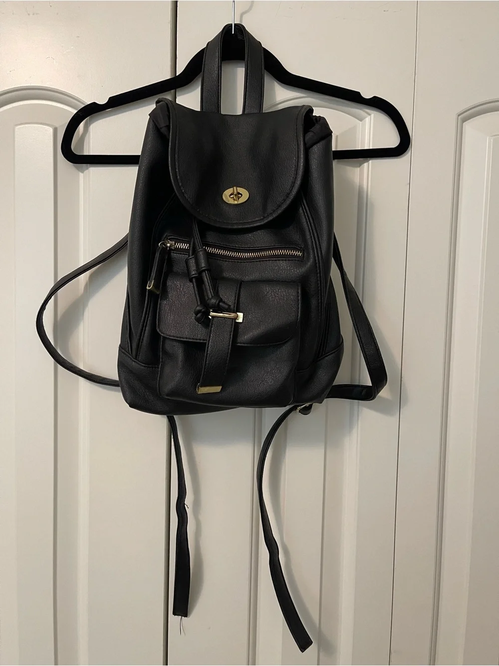 Sleek Black Faux Leather Mini Backpack with Gold Accents